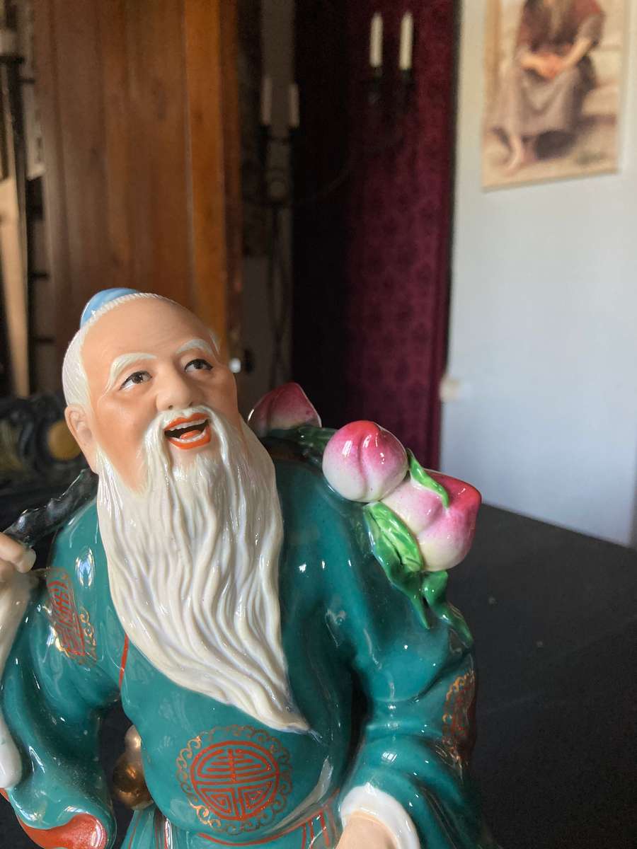 LARGE ORIENTAL STATUE