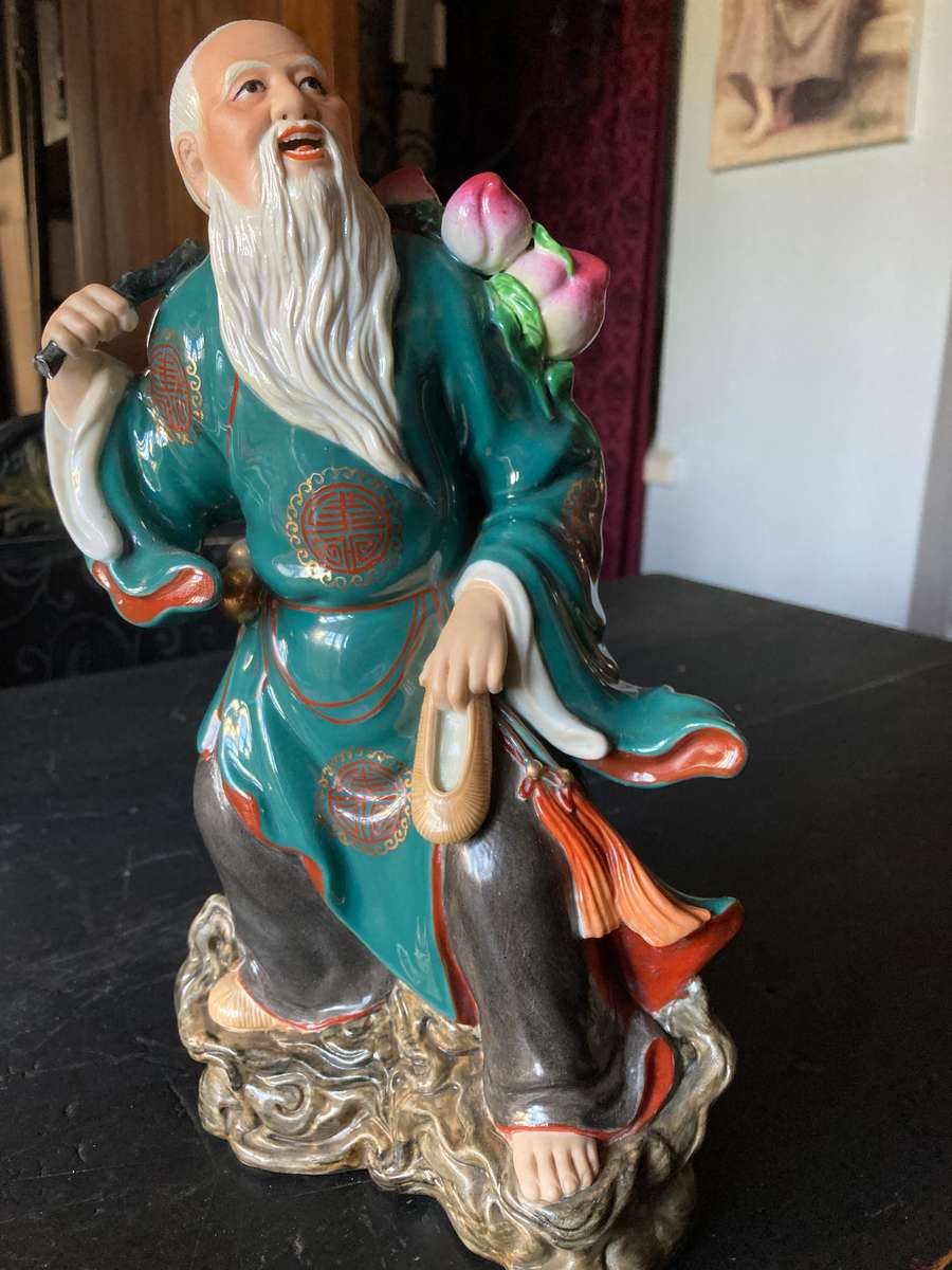 LARGE ORIENTAL STATUE