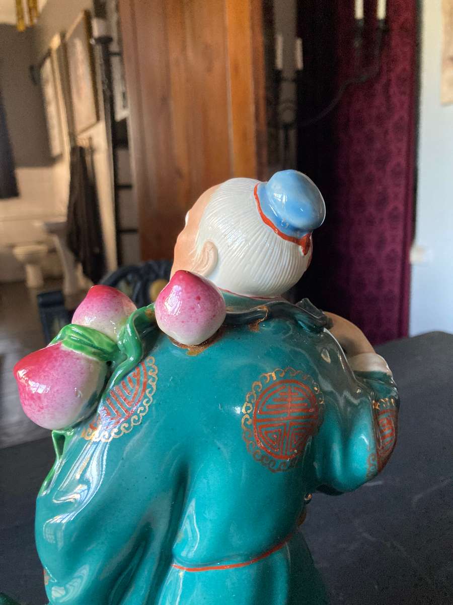 LARGE ORIENTAL STATUE