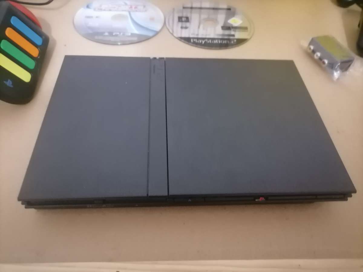 PS2 BUNDLE - CONSOLE - 2 x REMOTES AND 21 PS2 GAMES - 100% ORIGINAL - 100% WORKING LIKE NEW