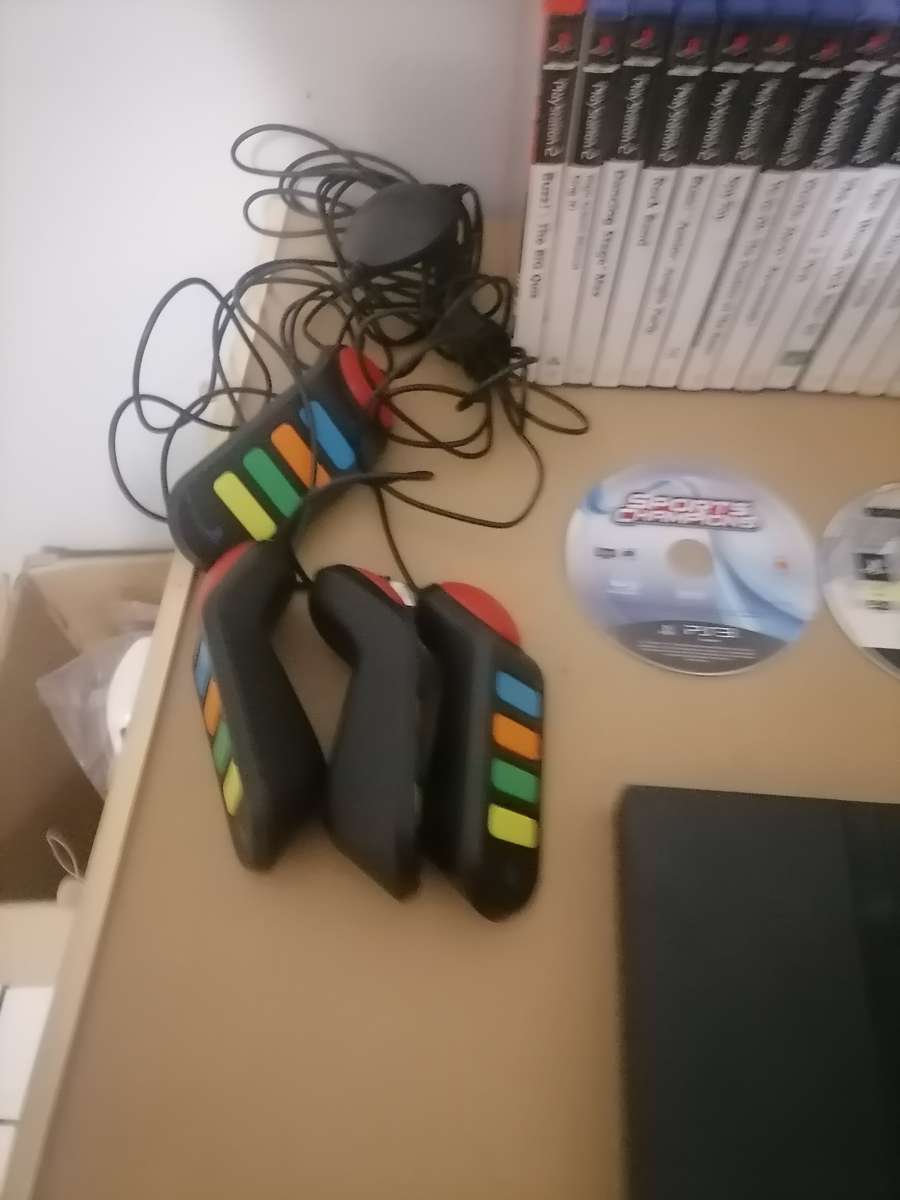 PS2 BUNDLE - CONSOLE - 2 x REMOTES AND 21 PS2 GAMES - 100% ORIGINAL - 100% WORKING LIKE NEW