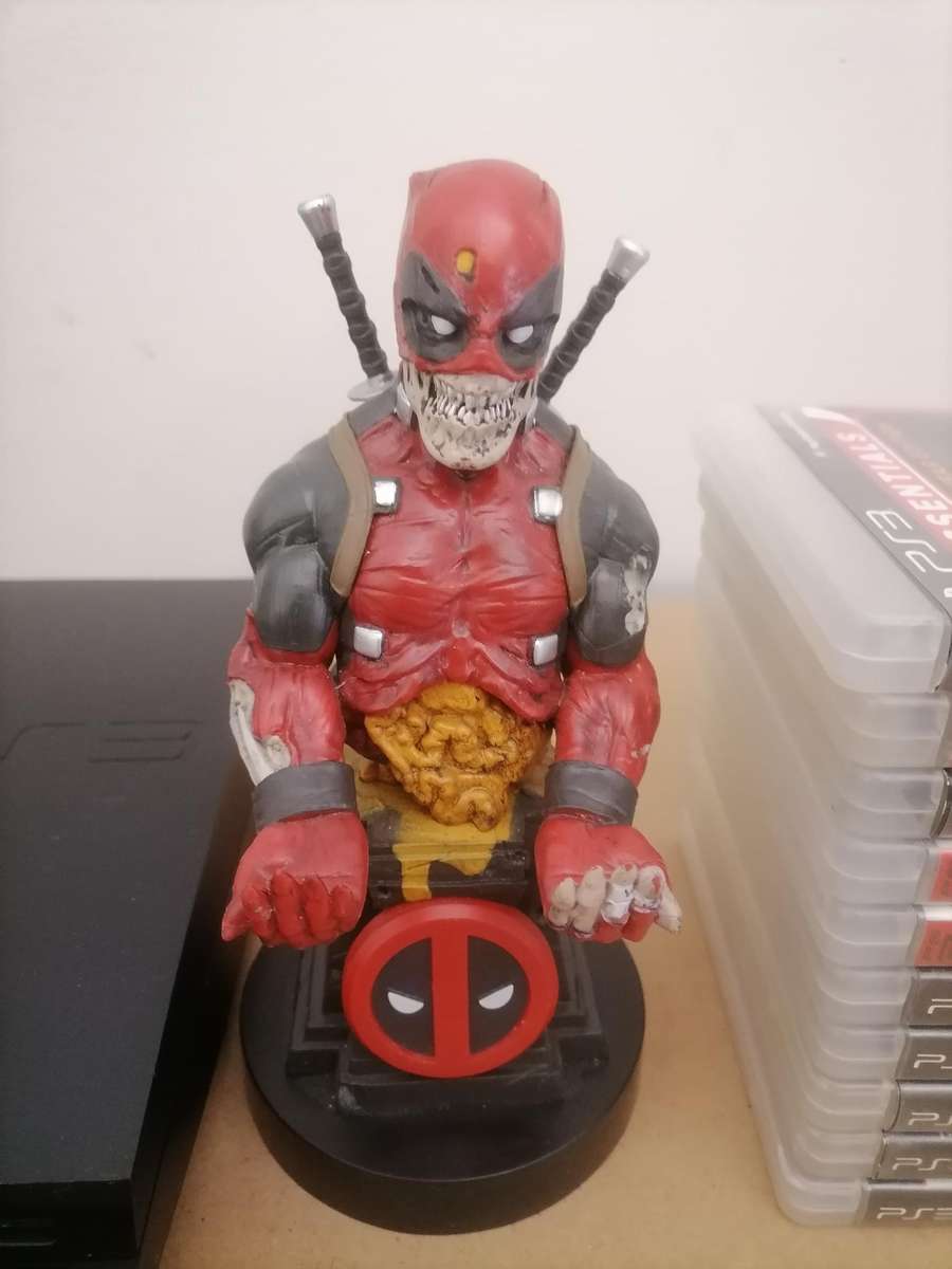 PS3 Bundle - Console 320 GB with Remote & Marvel Cable Guy: Deadpool Zombie Stand & 10 Games