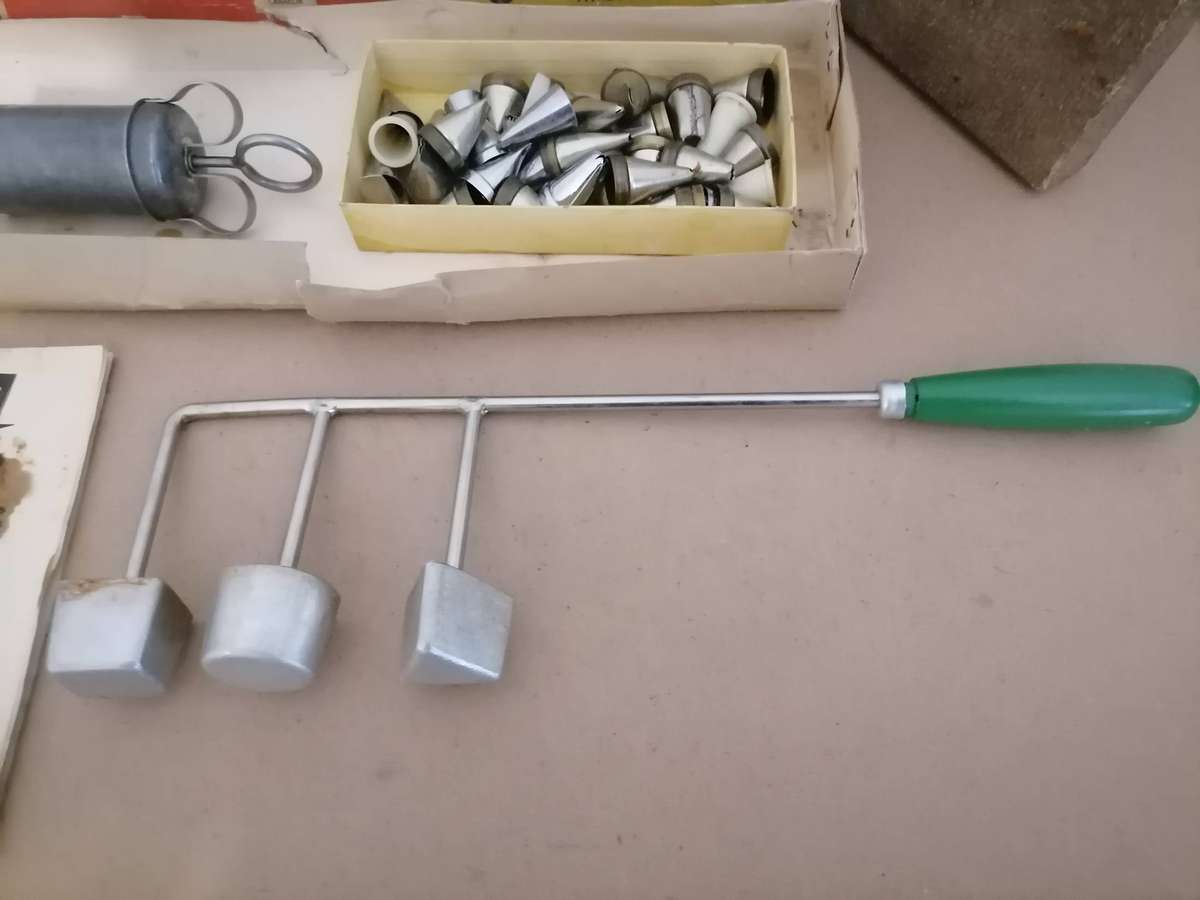 Vintage Snackle Iron set, a kitchen tool used to make deep-fried treats like fritters or rosettes