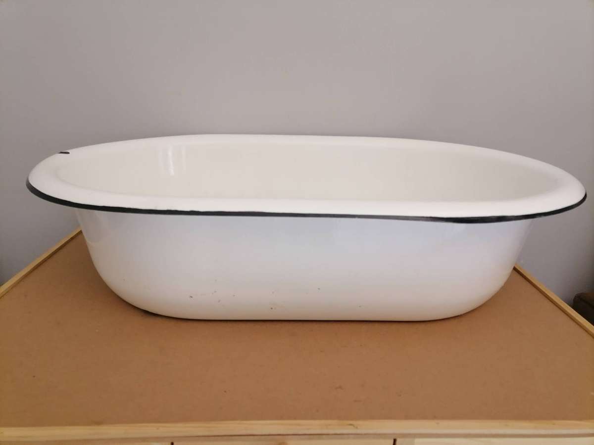 Vintage enamel wash basin, often used as a baby bathtub or for general washing purposes