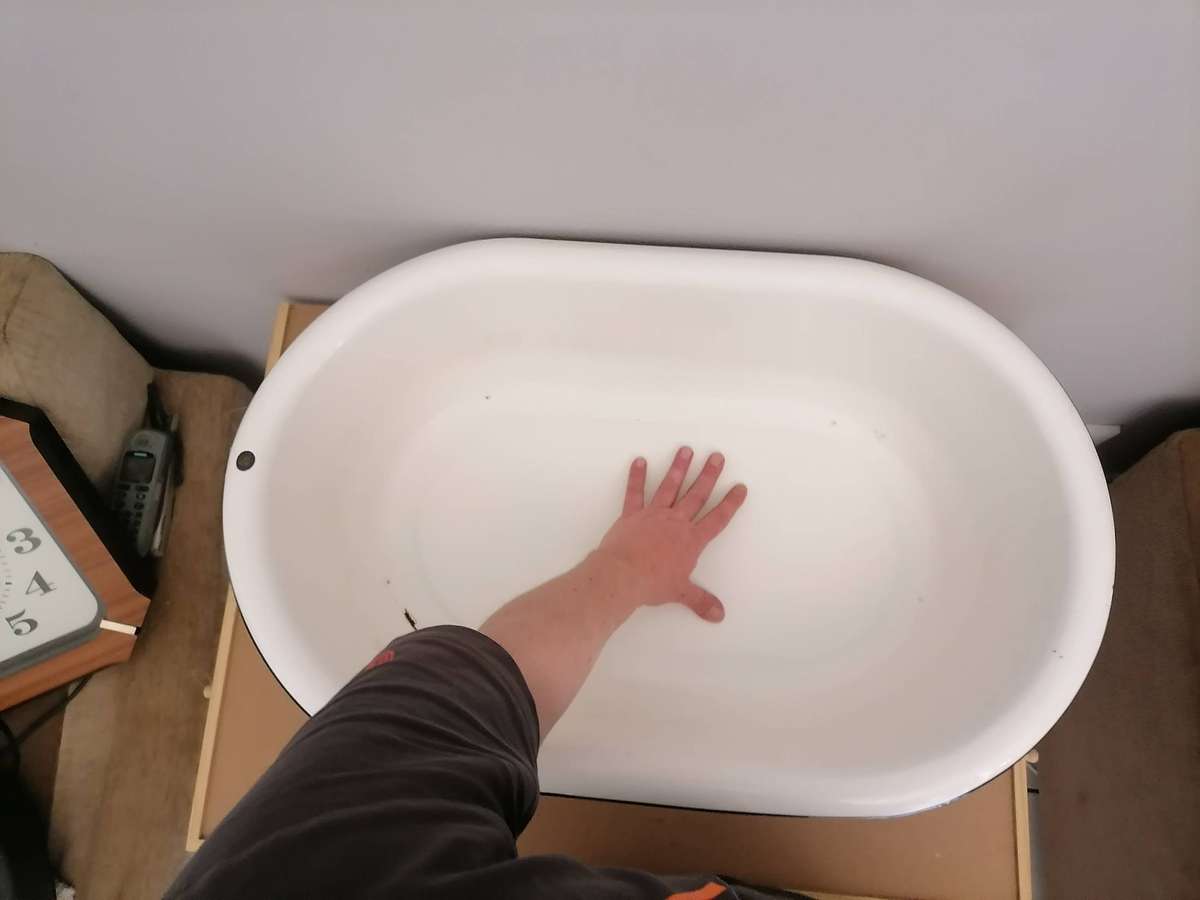 Vintage enamel wash basin, often used as a baby bathtub or for general washing purposes