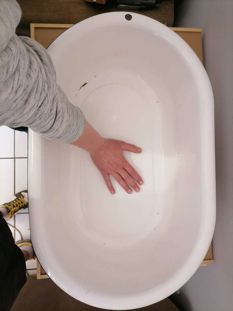 Vintage enamel wash basin, often used as a baby bathtub or for general washing purposes