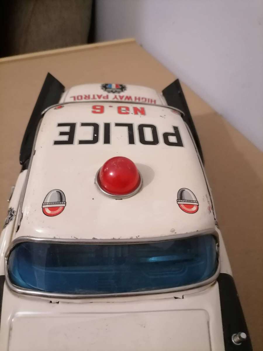 1957 FORD JAPANESE TIN POLICE CAR BY YONEZAWA NR FRICTION MECHANISM STILL WORKS 38 CM L X 17 CM B