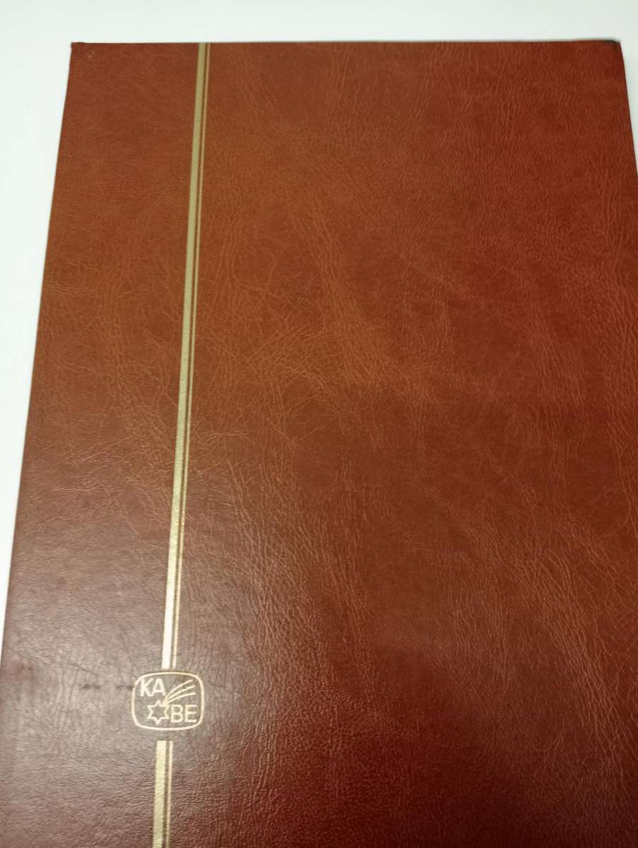 CLEAN STOCK BOOK with odds and ends.