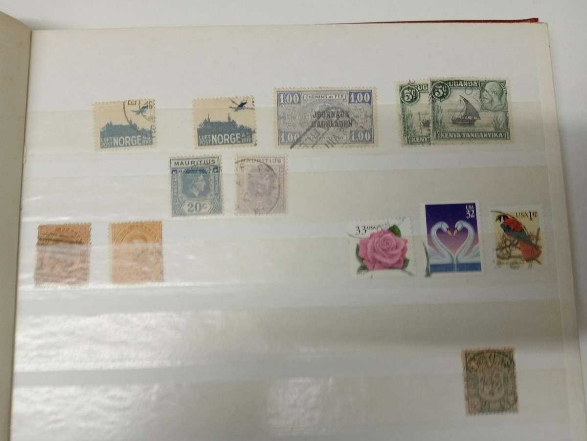 CLEAN STOCK BOOK with odds and ends.