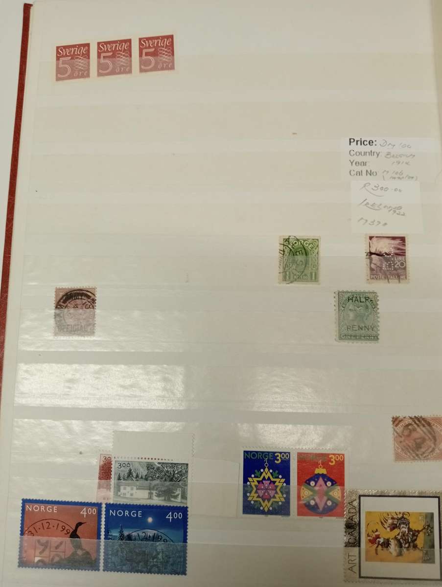 CLEAN STOCK BOOK with odds and ends.