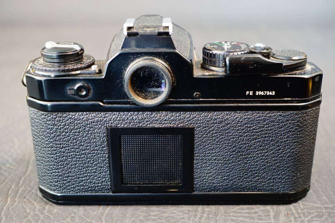 Black Nikon FE 35mm SLR Camera with Nikon Micro Nikkor 55mm F3.5 Lens
