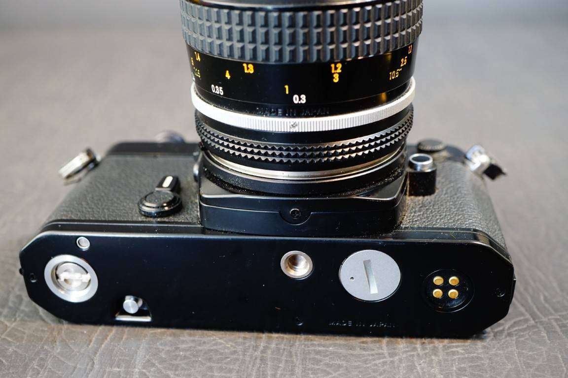 Black Nikon FE 35mm SLR Camera with Nikon Micro Nikkor 55mm F3.5 Lens