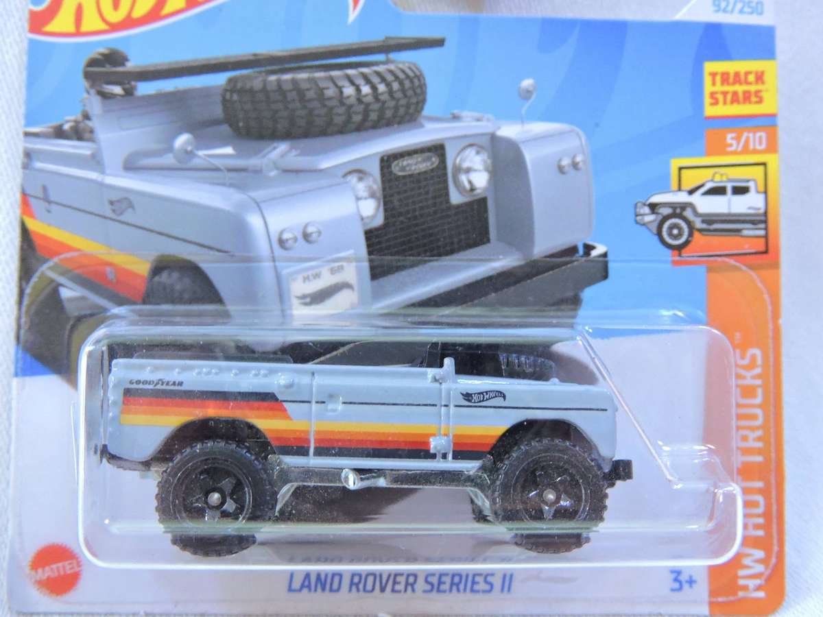 Hot Wheels Land Rover Series 11 ( Grey with Surf Board )