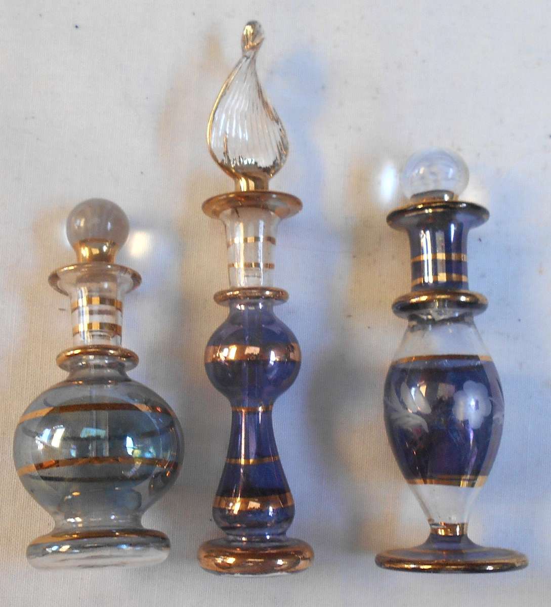 STUNNING three MINIATURE dark blue /purple COLOUR EGYPTIAN GLASS PERFUME BOTTLES WITH DAPPERS