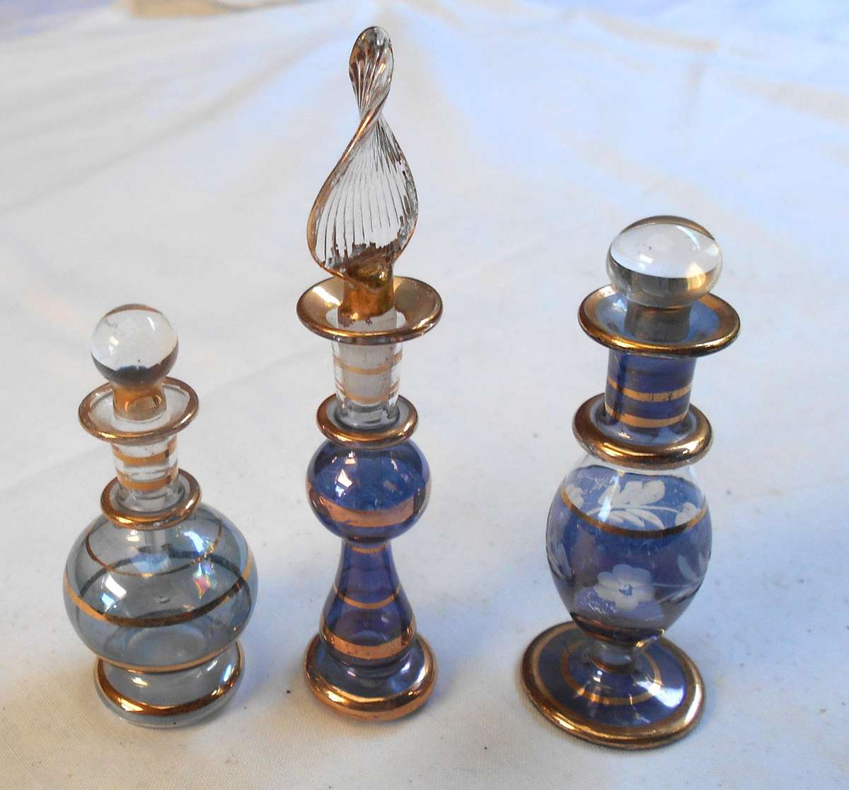 STUNNING three MINIATURE dark blue /purple COLOUR EGYPTIAN GLASS PERFUME BOTTLES WITH DAPPERS