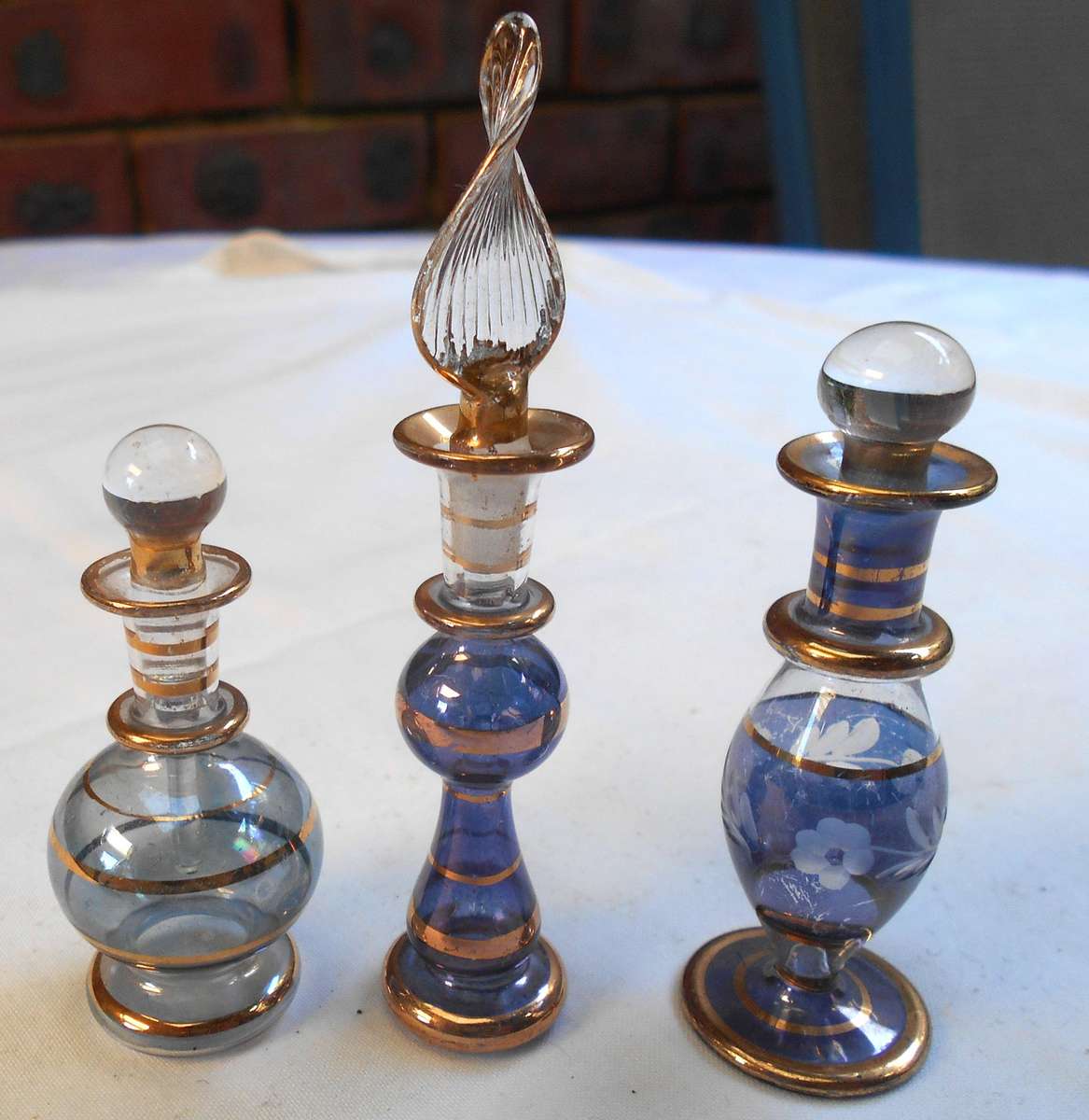 STUNNING three MINIATURE dark blue /purple COLOUR EGYPTIAN GLASS PERFUME BOTTLES WITH DAPPERS