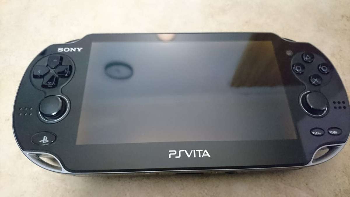 Sony PlayStation Vita OLED WiFi 3G Console - Black (PS Vita) + Sony Memory Card + Games