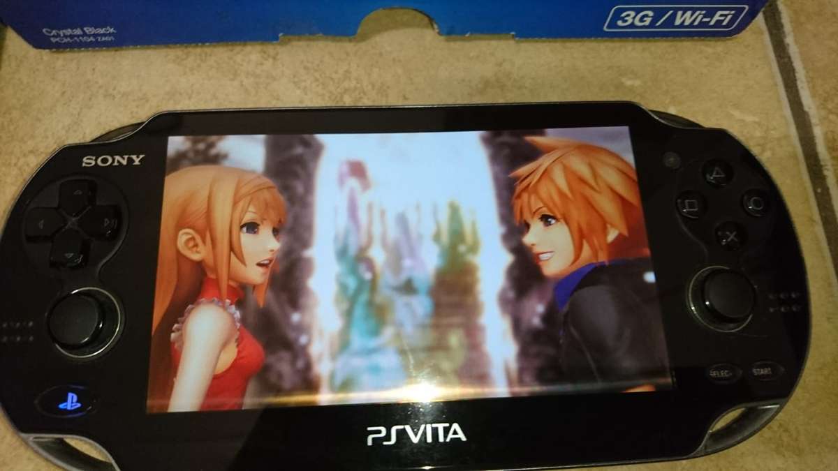 Sony PlayStation Vita OLED WiFi 3G Console - Black (PS Vita) + Sony Memory Card + Games