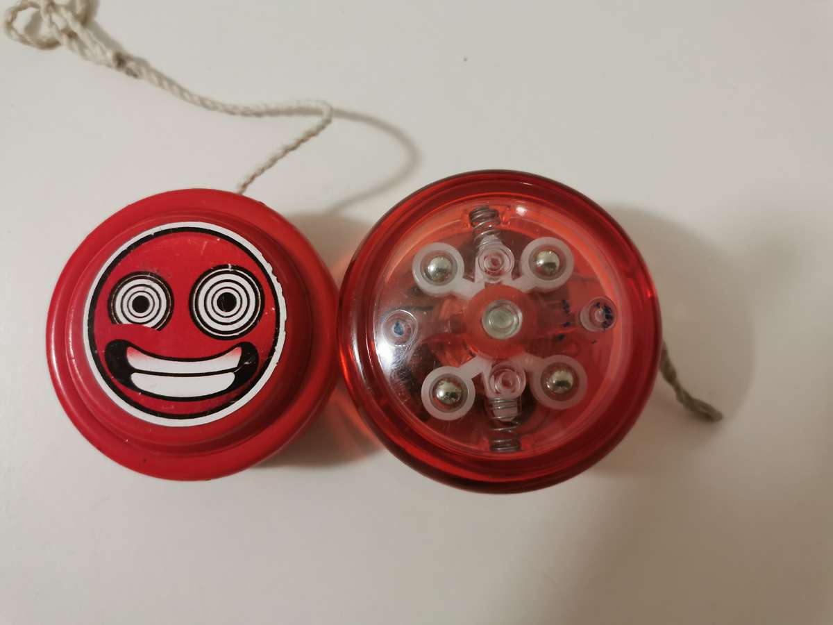 Two yoyos - light up and coke.