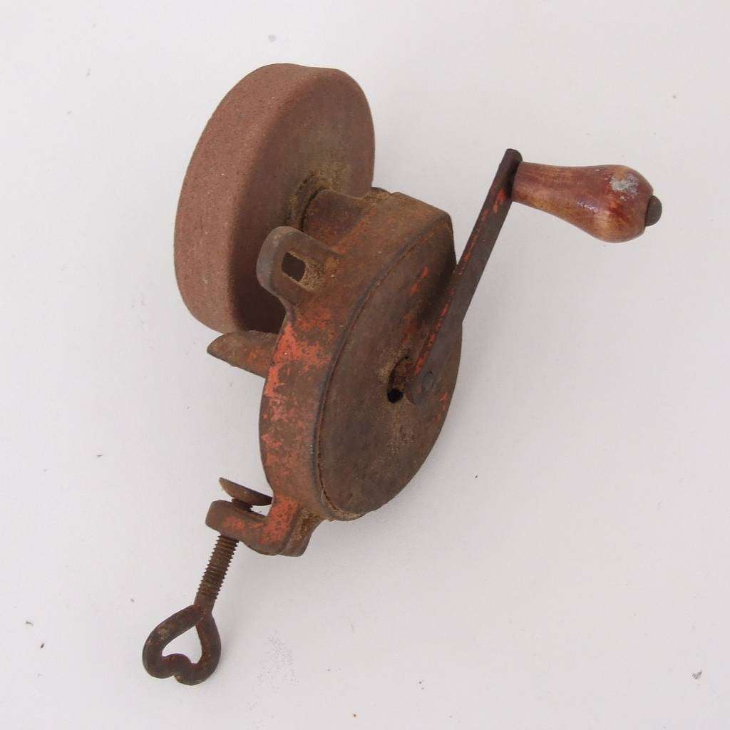 Vintage mechanical hand crank grinding wheel