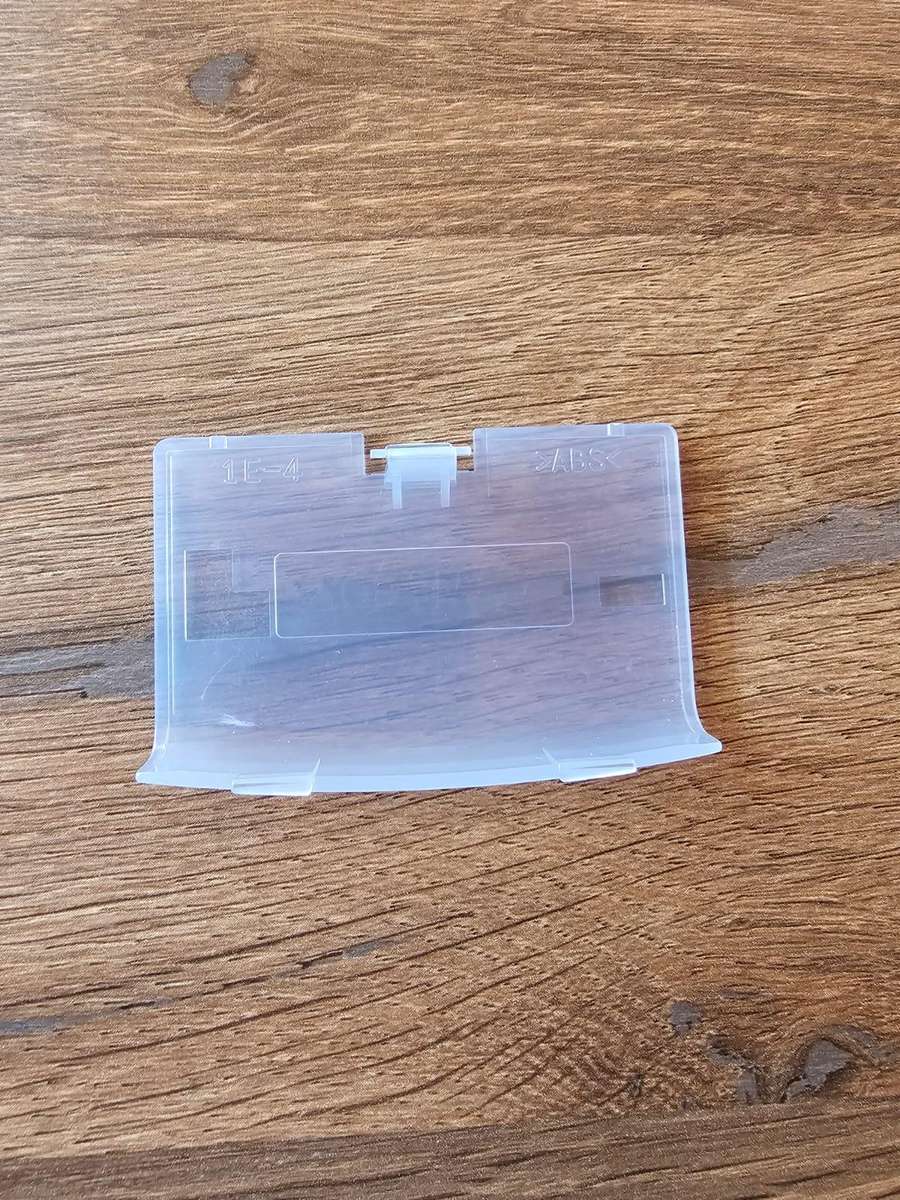 Nintendo Game Boy Advance battery cover (original, transparent blue)