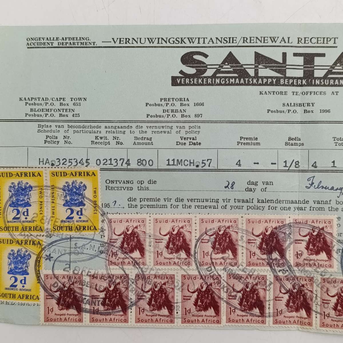 1957 Santam receipt with 3x revenue stamps and 14x 1d postuge stamps used as revenue stamps