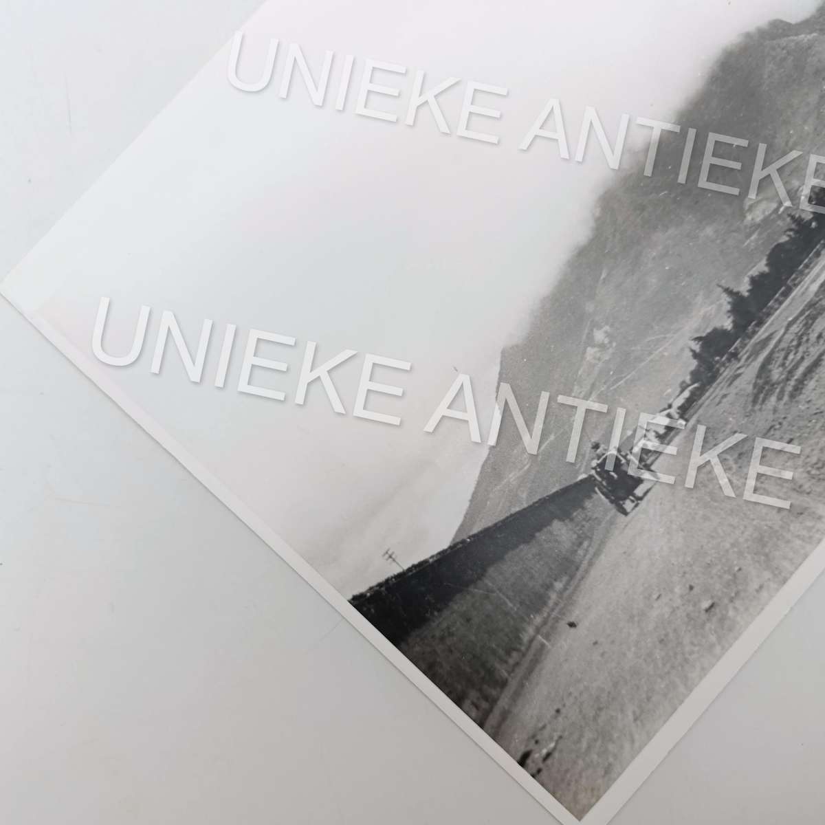 Antique photo reprint of horse cart next to Castle of Good Hope wall with Devils Peak in back