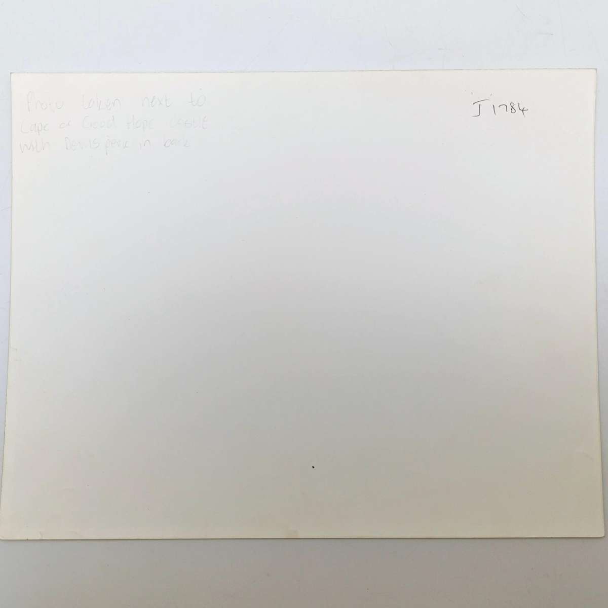 Antique photo reprint of horse cart next to Castle of Good Hope wall with Devils Peak in back