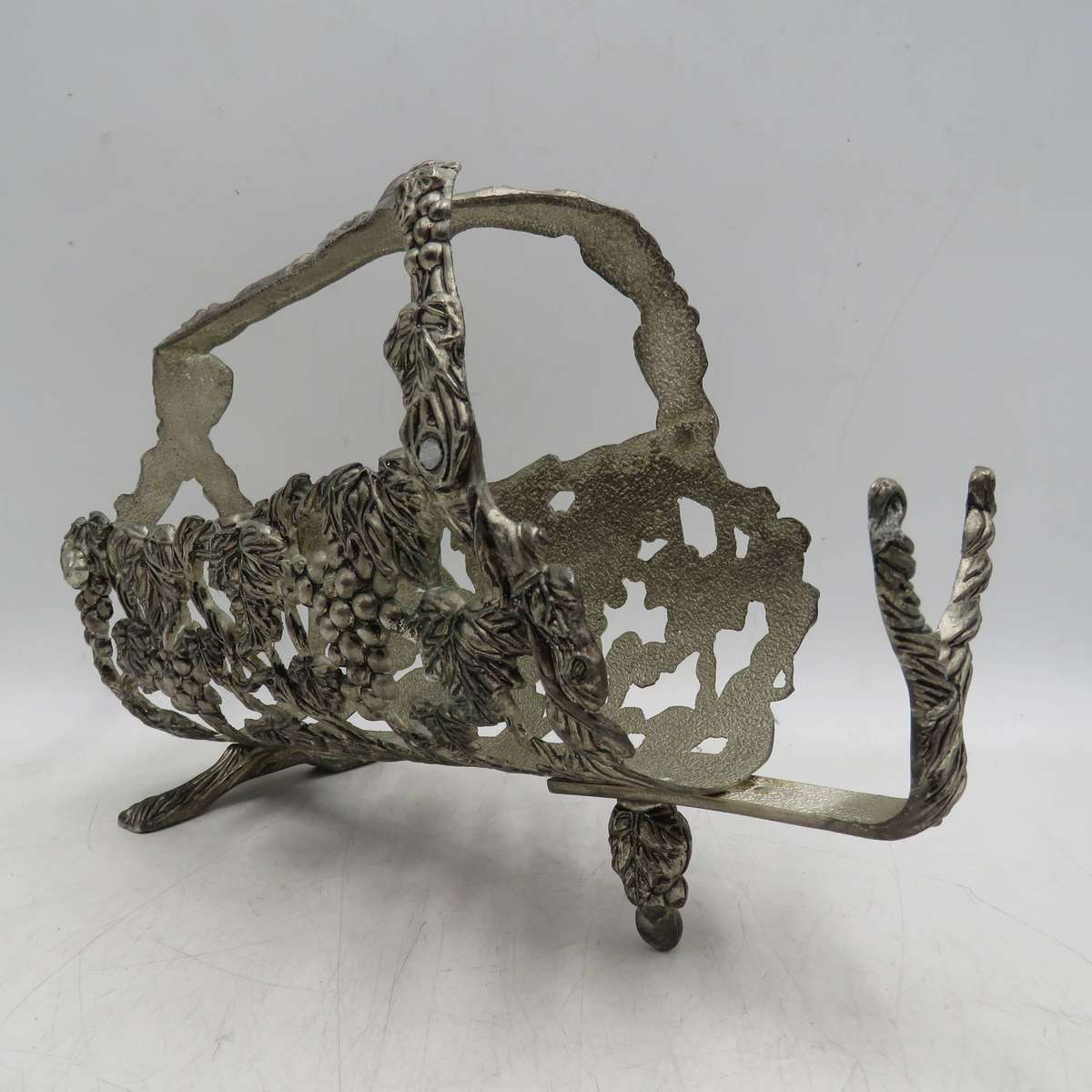 Vintage silverplated vintner motif wine bottle stand