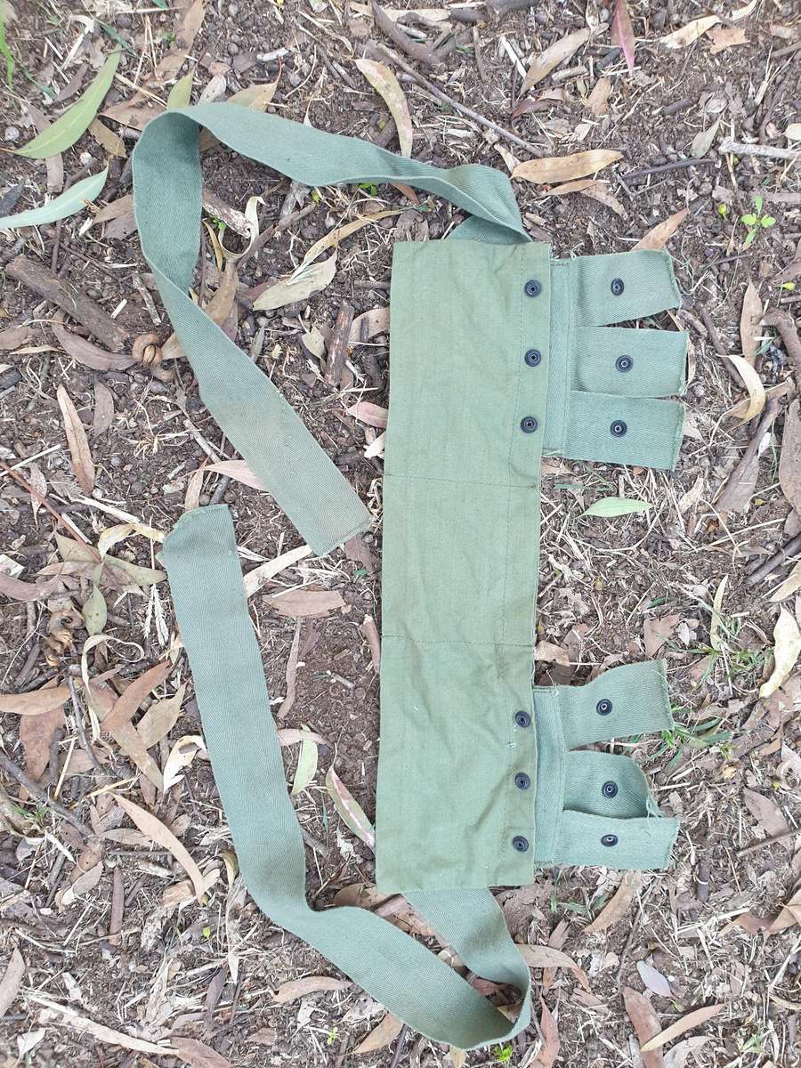 used (clean & typically discarded) SADF era green thin canvas disposable 40mm 6 round ammo bandolier