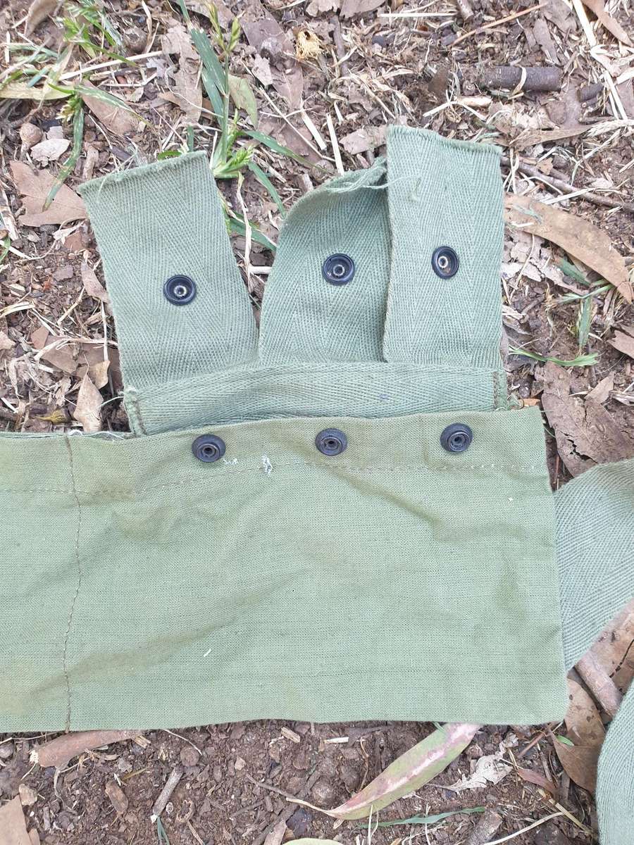 used (clean & typically discarded) SADF era green thin canvas disposable 40mm 6 round ammo bandolier