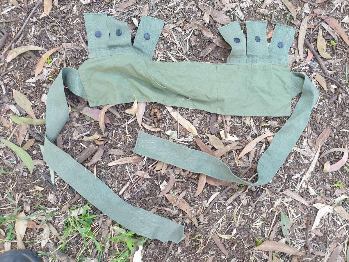 used (clean & typically discarded) SADF era green thin canvas disposable 40mm 6 round ammo bandolier