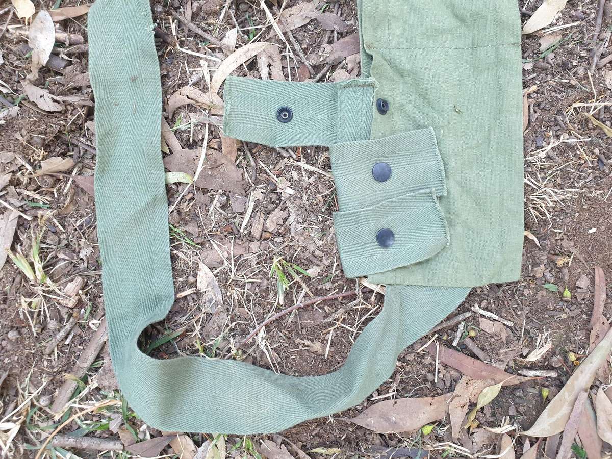 used (clean & typically discarded) SADF era green thin canvas disposable 40mm 6 round ammo bandolier