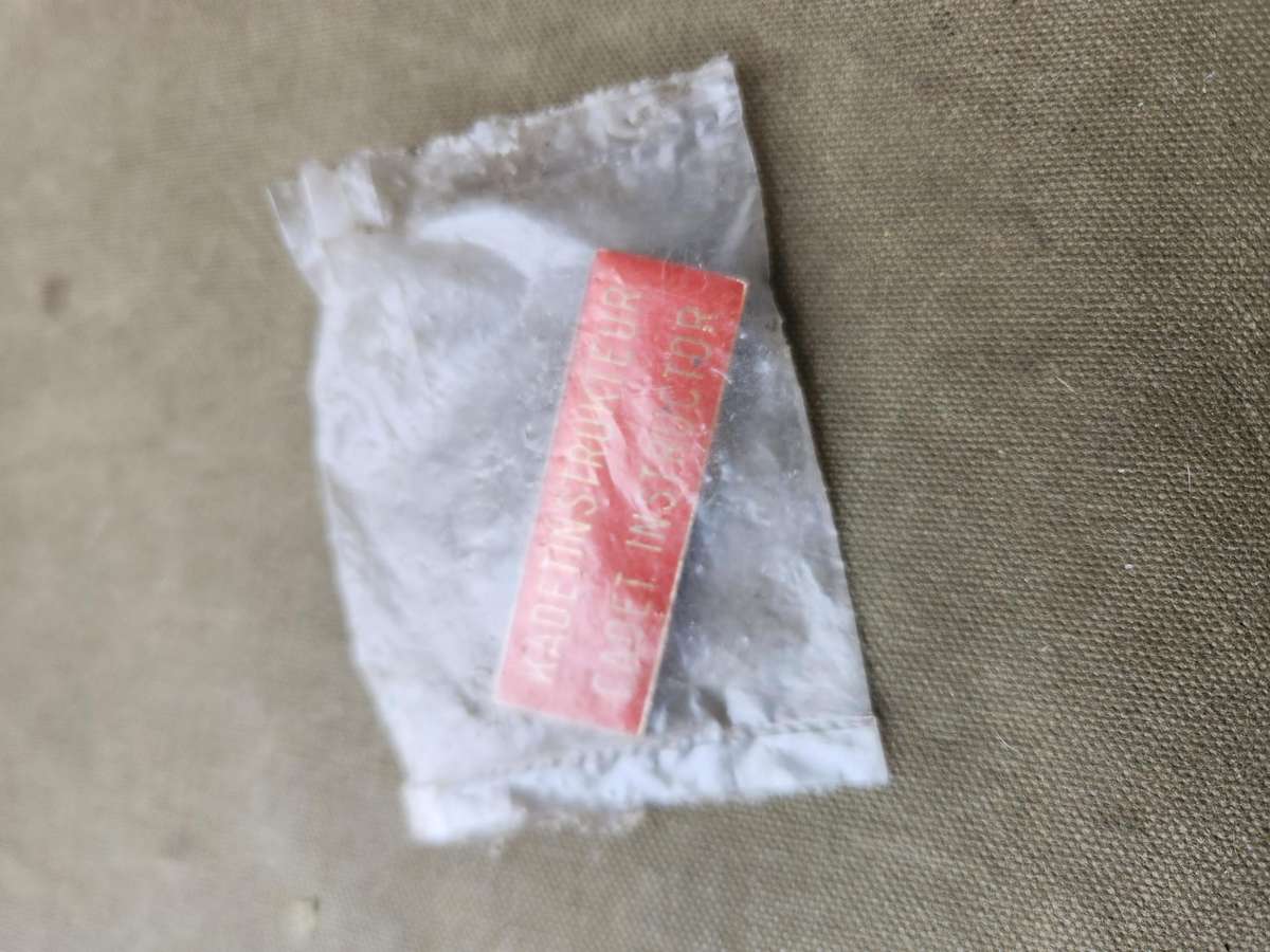 scarce SADf era RSA Schools Cadet Instructor breast badge - both rear pins intact (unused in packet)