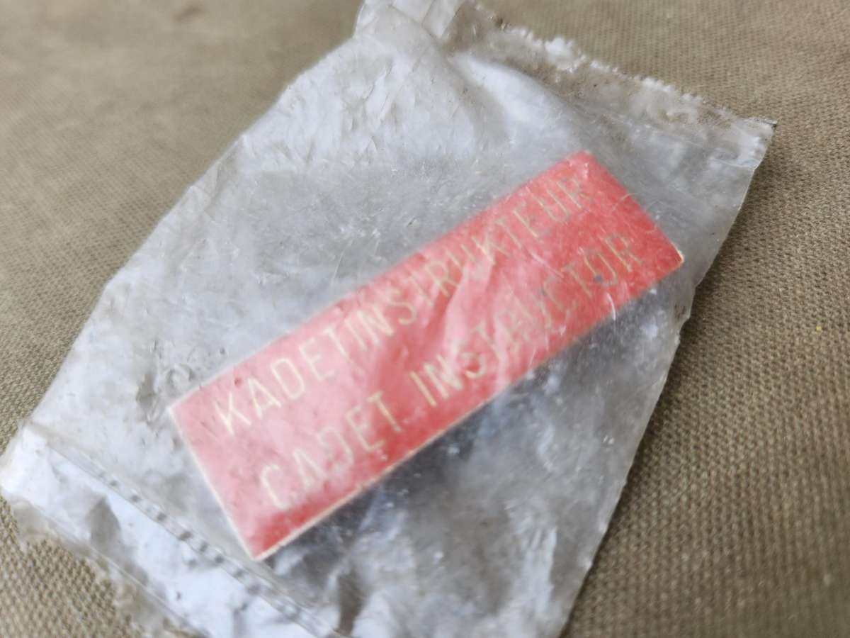 scarce SADf era RSA Schools Cadet Instructor breast badge - both rear pins intact (unused in packet)