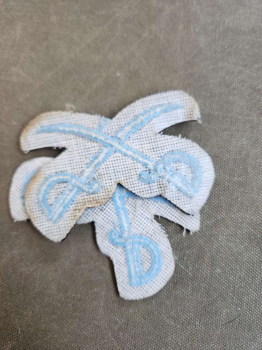 Pair of new & unused SADF era SAAF NCO Instructors (PTIs?) crossed swords badges for rank brassards