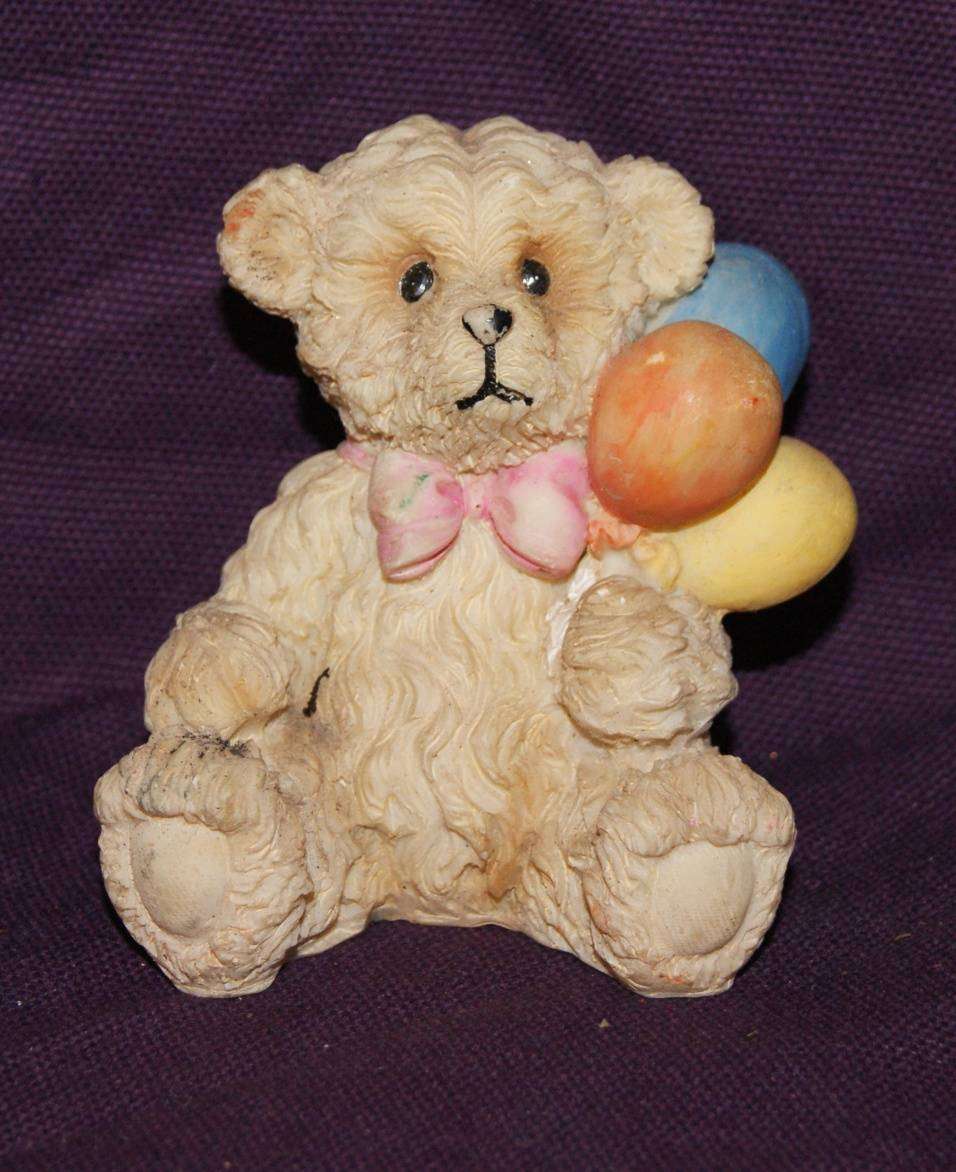 Teddy Bear Holding Balloons