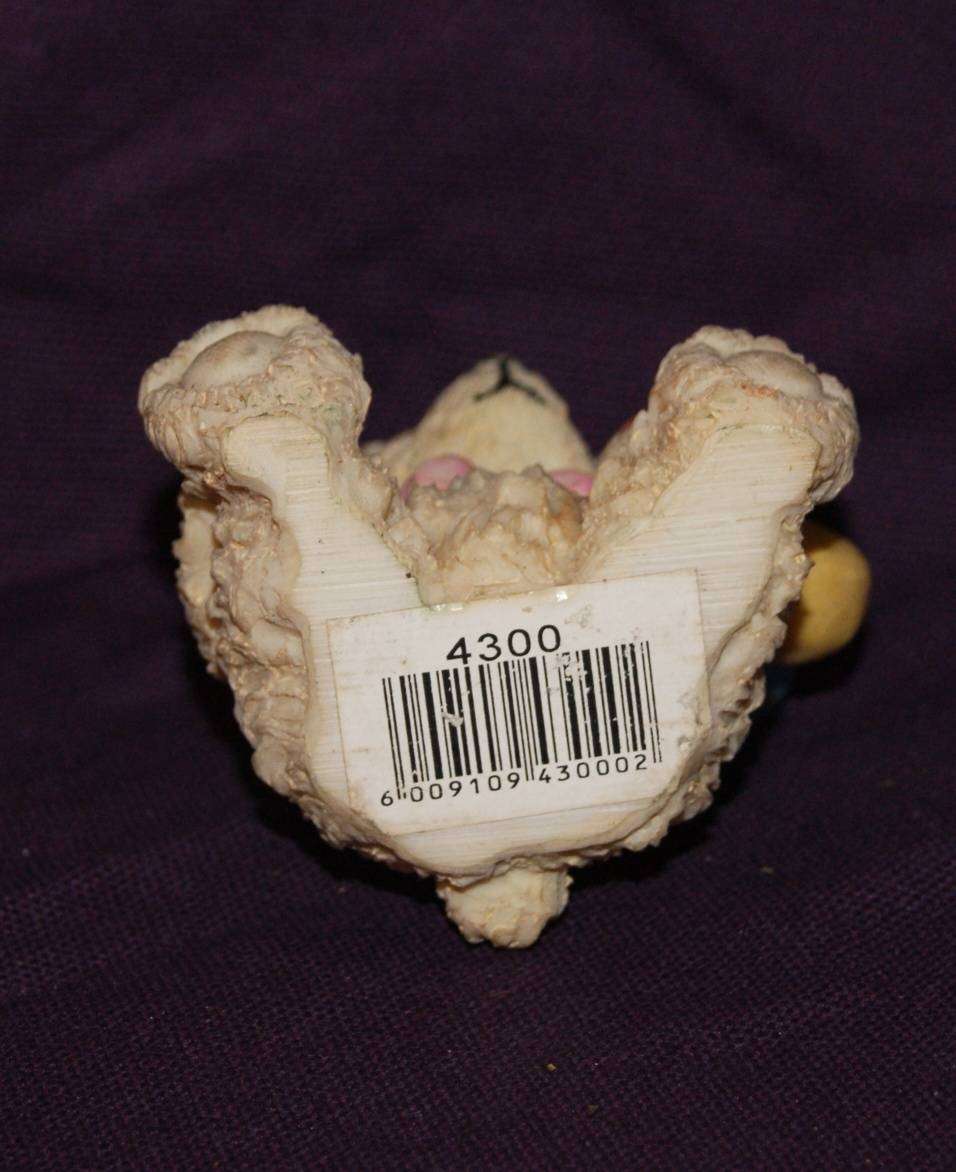 Teddy Bear Holding Balloons