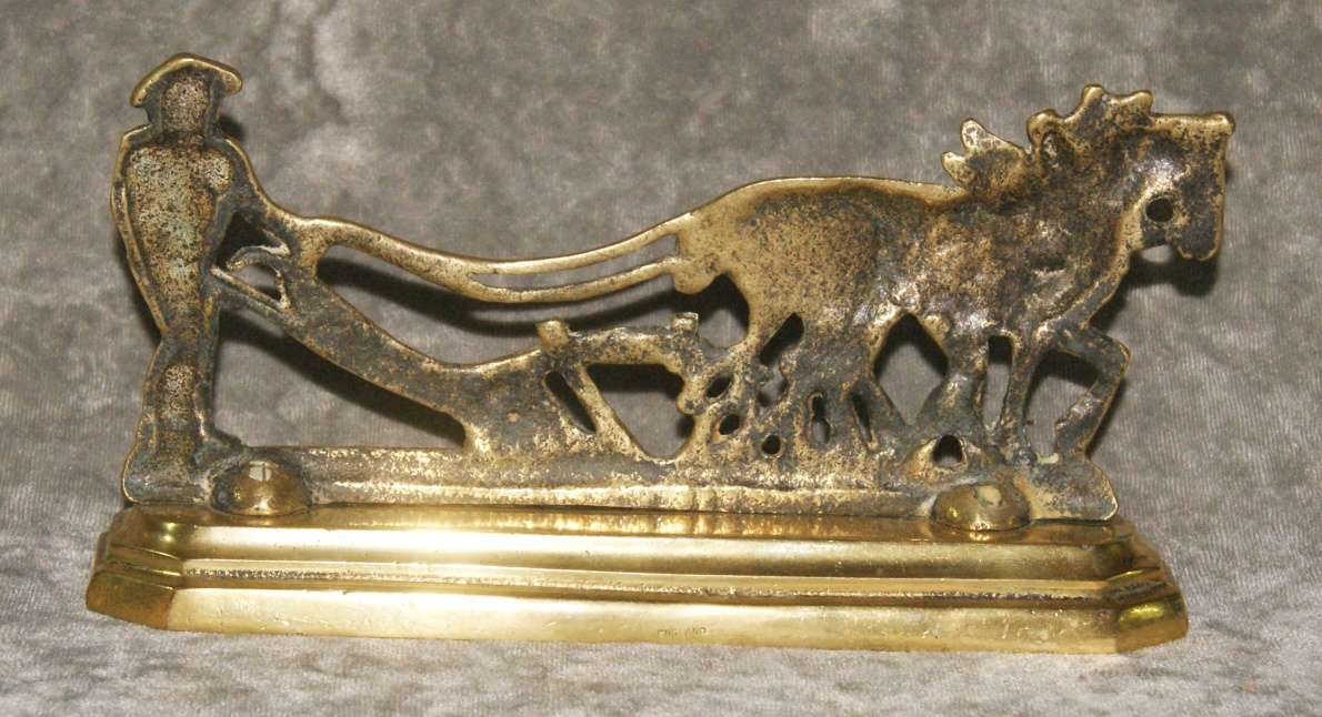 Antique brass doorstop