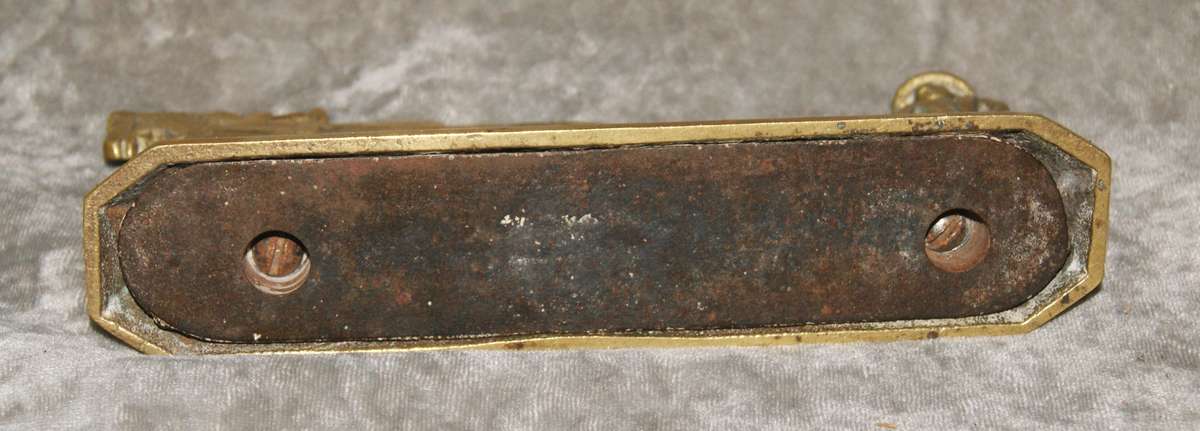 Antique brass doorstop