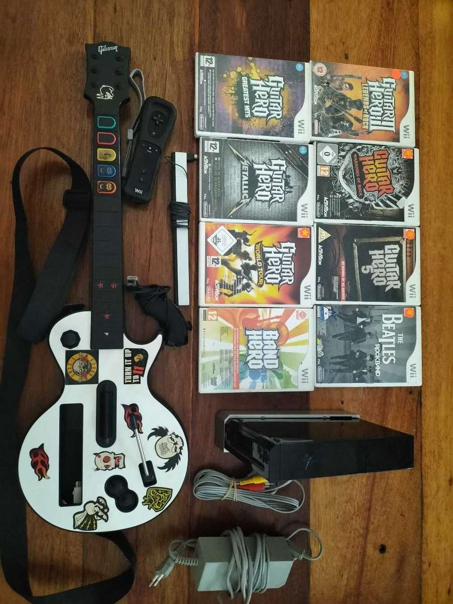 Wii Console Black with X8 Wii games and GH Guitar (Wii)