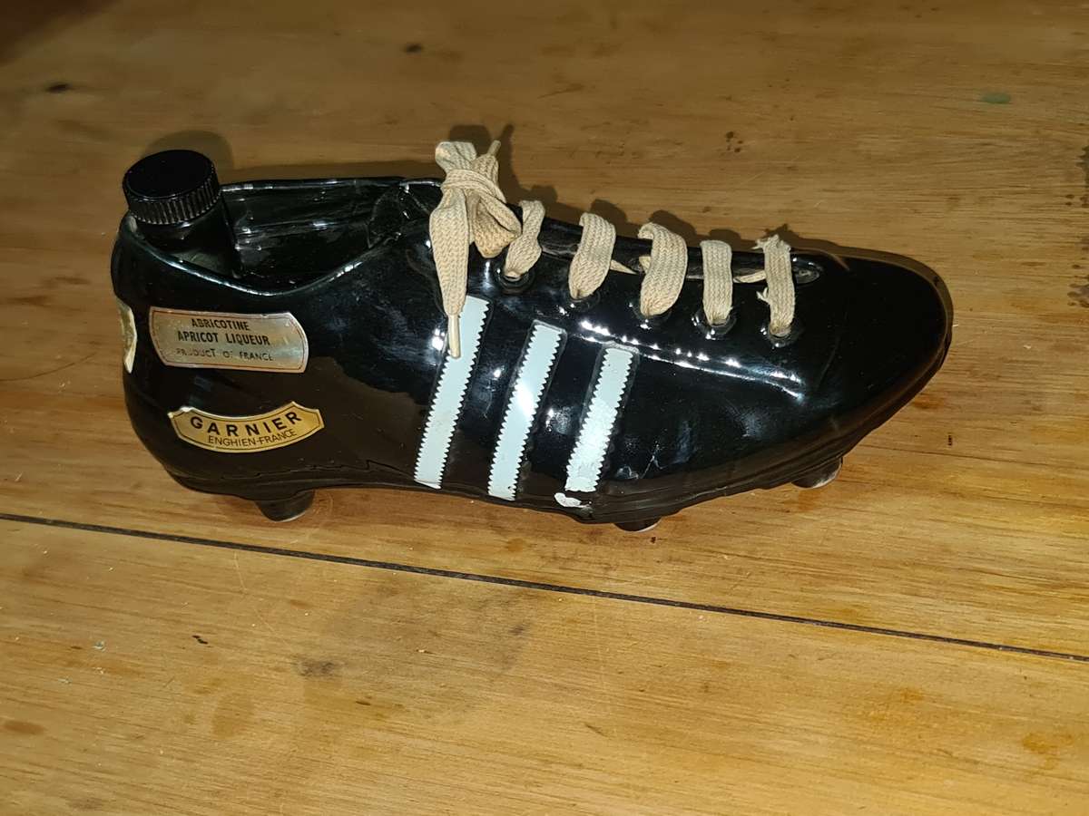 Liquor bottle in the shape of a rugby boot