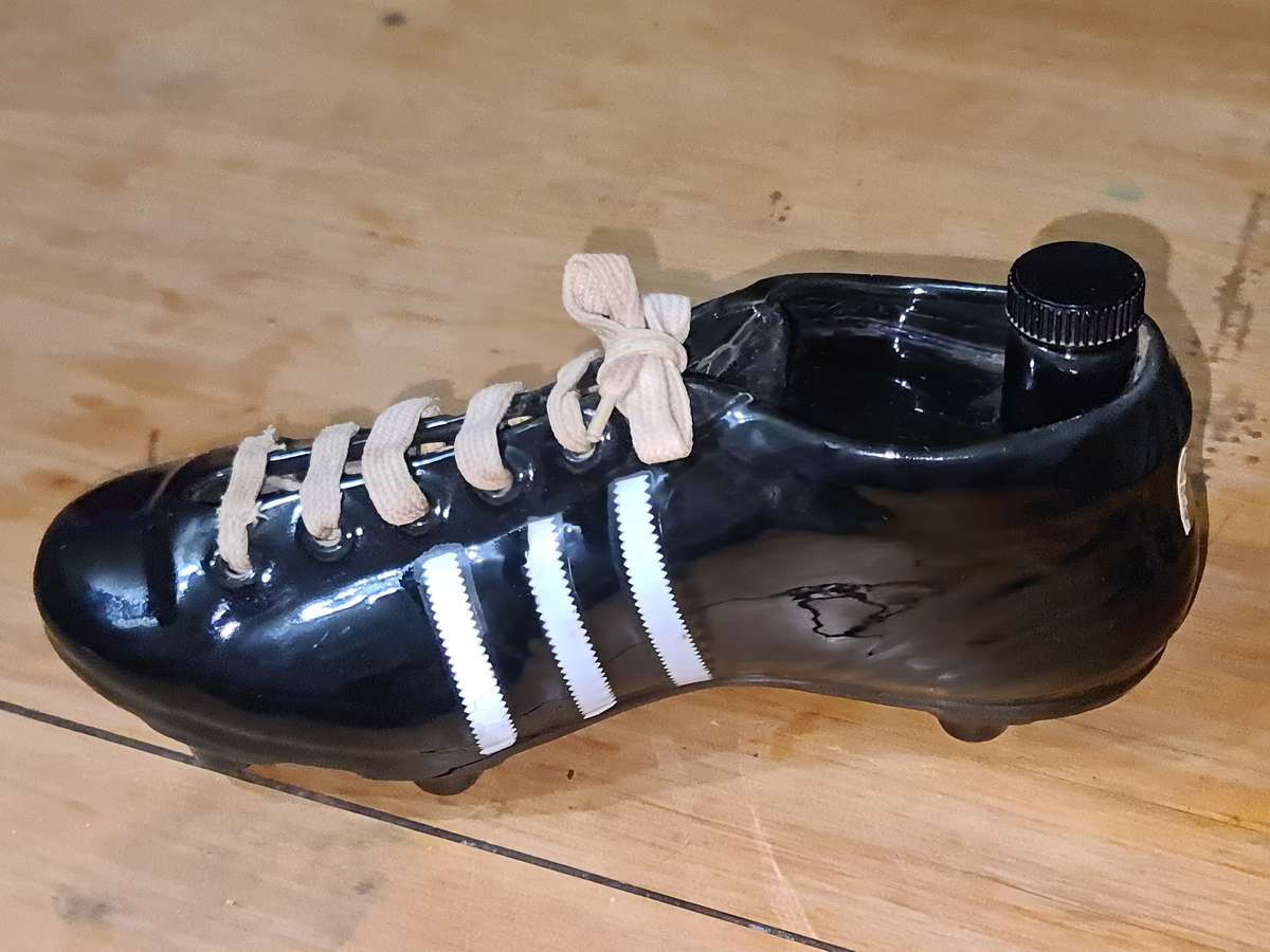 Liquor bottle in the shape of a rugby boot