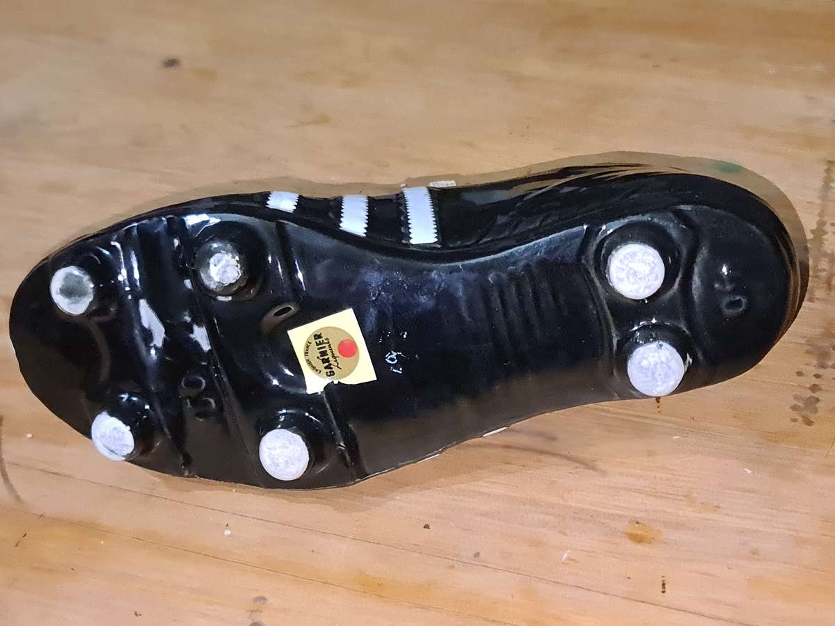 Liquor bottle in the shape of a rugby boot