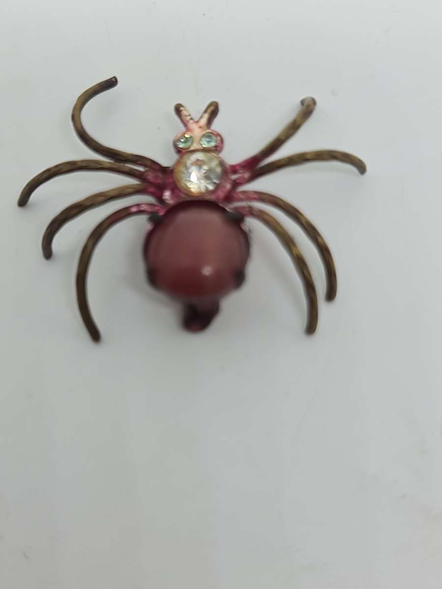 Brass tone spider brooch