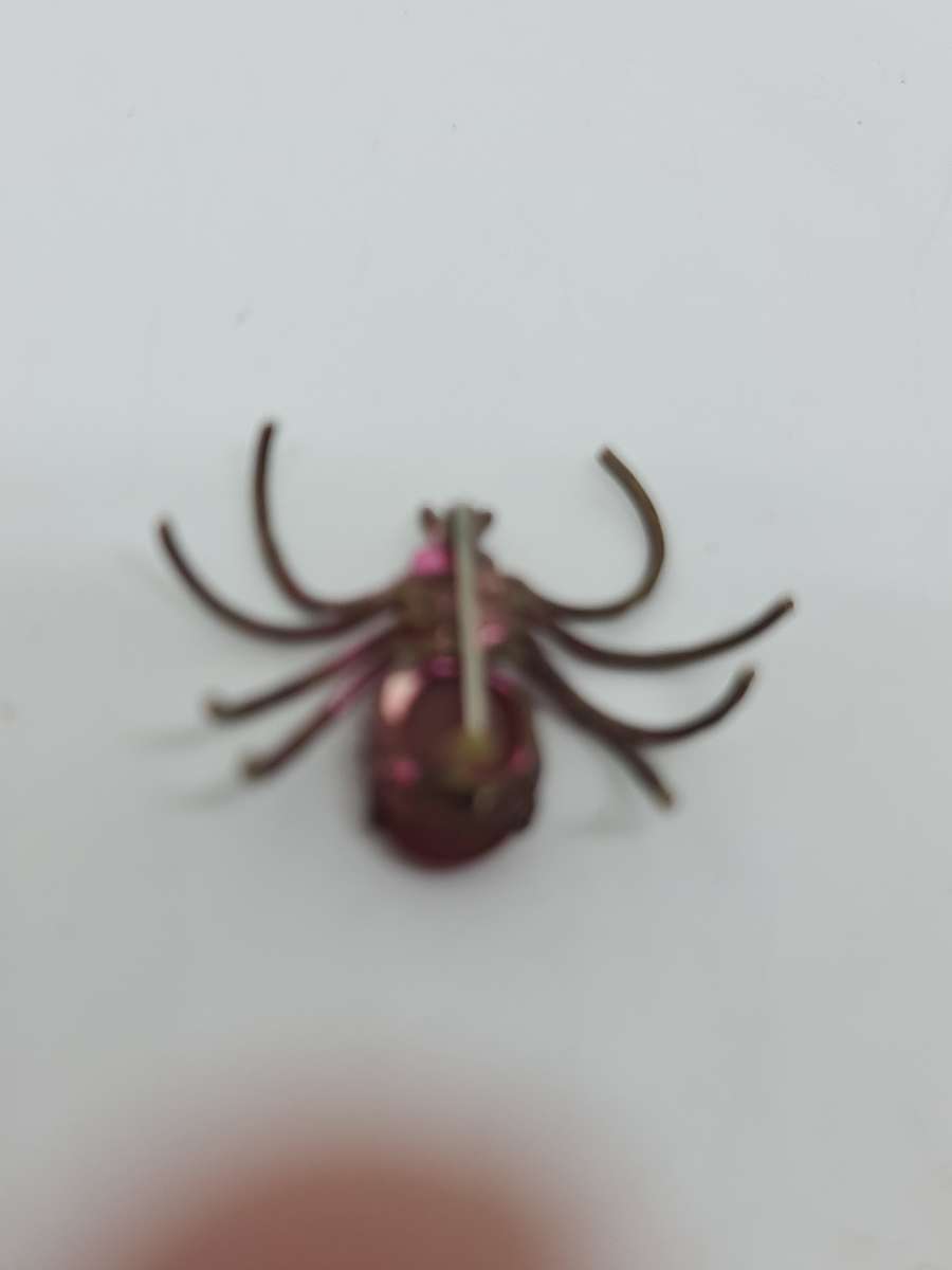 Brass tone spider brooch