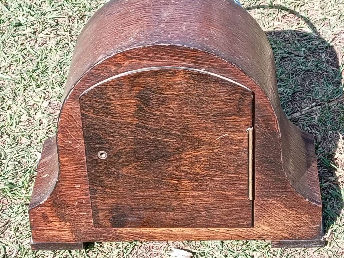 Vintage wooden empty clock case with chiming rodds