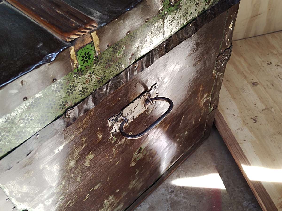 Antique metal steamer trunk