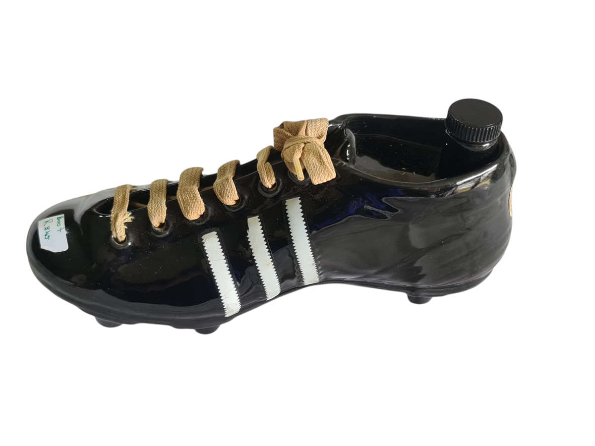 Liquor bottle in the shape of a rugby boot
