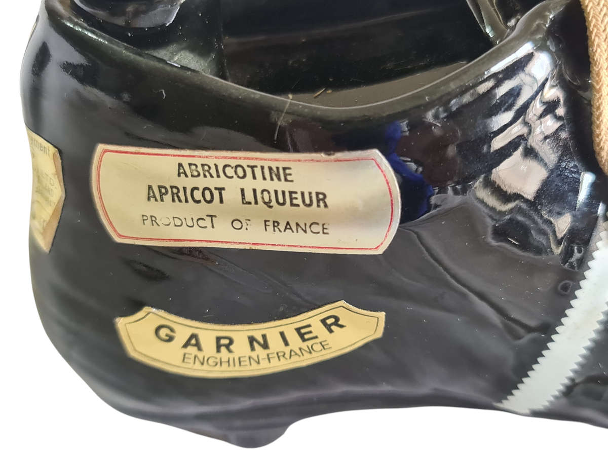 Liquor bottle in the shape of a rugby boot